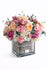 Blooming Cube – Modern floral arrangement in a cube vase with fresh seasonal flowers, perfect for birthday celebrations.