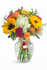 Fiesta Color – Vibrant floral arrangement with fresh seasonal flowers in bold, colorful tones, perfect for birthday celebrations.