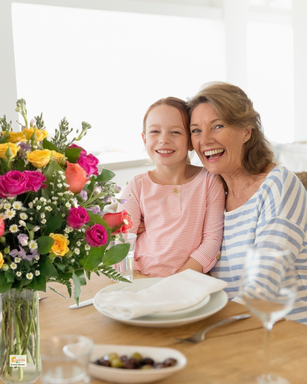 Sharing a joyful moment at breakfast with a vibrant floral bouquet. Perfect flower arrangement for Mother's Day, birthdays, and special family celebrations.